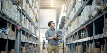 A man assessing the stock of a supplier