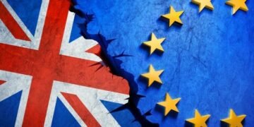 British and European flags meeting in the middle with a crack in between representing Brexit