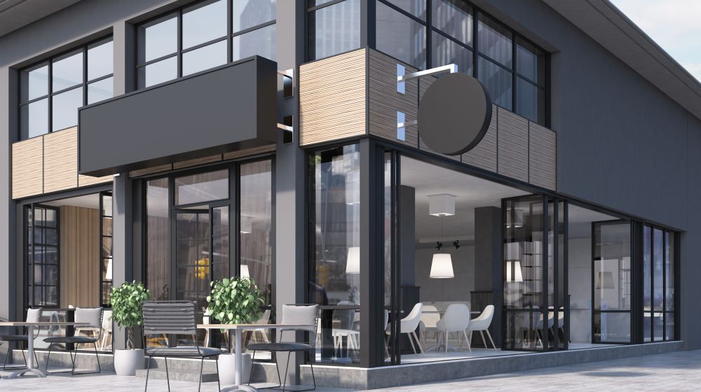 A commercial office building with a cafe at the bottom