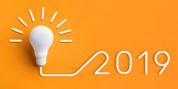 Light bulb next to the date 2019, a symbol for all the top tips for startups in 2019