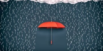 An umbrella stopping the rain as a metaphor for how insurance can protect a business from risk