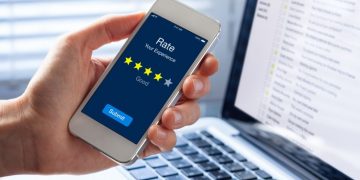 A customer using an application on their phone to leave a review for an online service