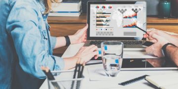 Two colleagues assessing marketing methods and deciding what to do