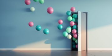 Balloons flying out of an office door to symbolising welcoming a new employee