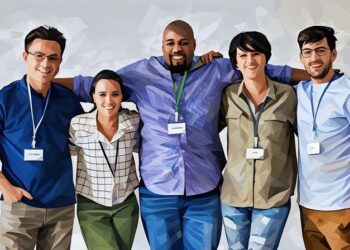 A group of key employees standing together as a team