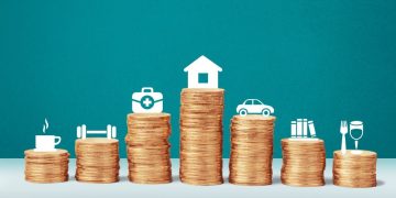 Piles of coins with symbols above showing things like houses and cars which you might get a loan for