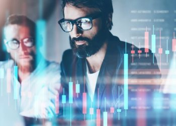 Two cryptocurrency investors looking at charts