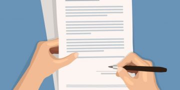 A person signing a contract on top of a pile of complex legal contracts