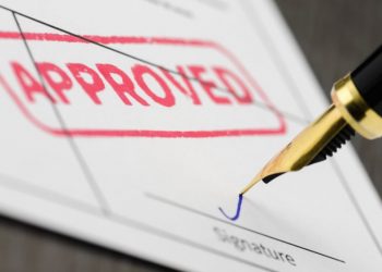 A form with an approved stamp on it symbolising a successful trademark application