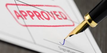 A form with an approved stamp on it symbolising a successful trademark application