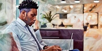 A person working on a couch with a laptop out of a co-working space due to his workplaces flexible working policy
