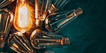A series of light bulbs with one lit up as an example of how essential business electricity is