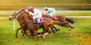 Horses mid race track