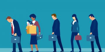 A series of fired employees leaving work, as an example of what redundancy means