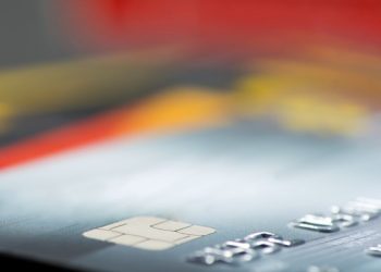Business banking debit cards set against a blurred background