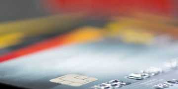Business banking debit cards set against a blurred background