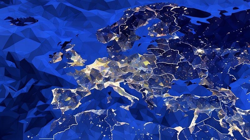 A photo of europe from above at night, showing industrialization through the lights that are switched on