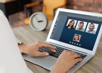 Leader video chatting with team via Zoom