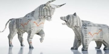 A bear and a bull covered, covered in newspapers showing the financial markets going up and down