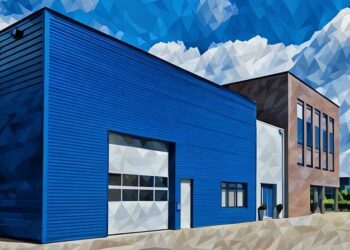 A blue warehouse rented out as a commercial property in an business park