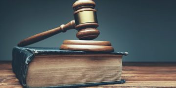 A judges hammer on books as a symbol for the importance of getting the proper legal protection for your business