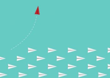 Papers planes flying with one diverting up, showing how a changed strategy for the new normal can help businesses grow