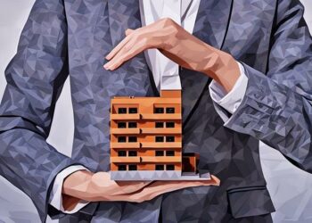 A man holding a model of a towerblock, as an example of how buy-to-let buildings insurance could protect the landlord