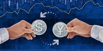 Yen Vs Dollar currency pairing example in human hands against a chart