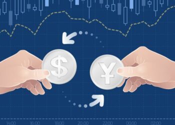 Yen Vs Dollar currency pairing example in human hands against a chart