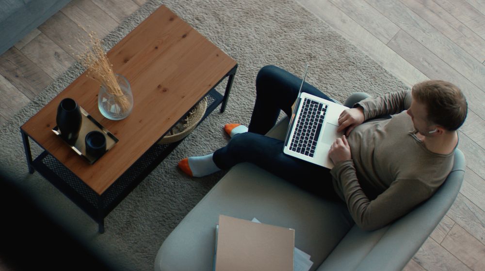Remote working person starting a business from a couch