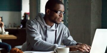 A freelancer working on a laptop at home