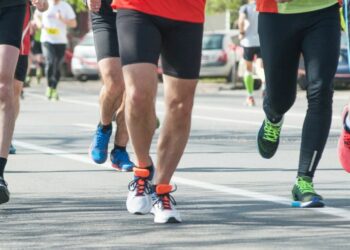 A series of runners taking part in a charity run in motion