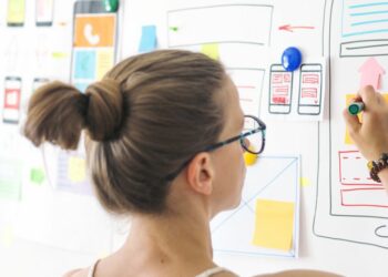 A person using a whiteboard to sketch out better website UX