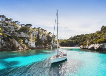 A picture of a yacht as an ironic example of how your life could be with remote teams but likely will not