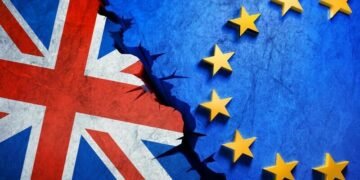 A British flag colliding with an EU flag