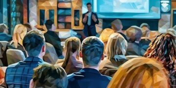Person giving sales presentation and nailing it in front of engaged audience