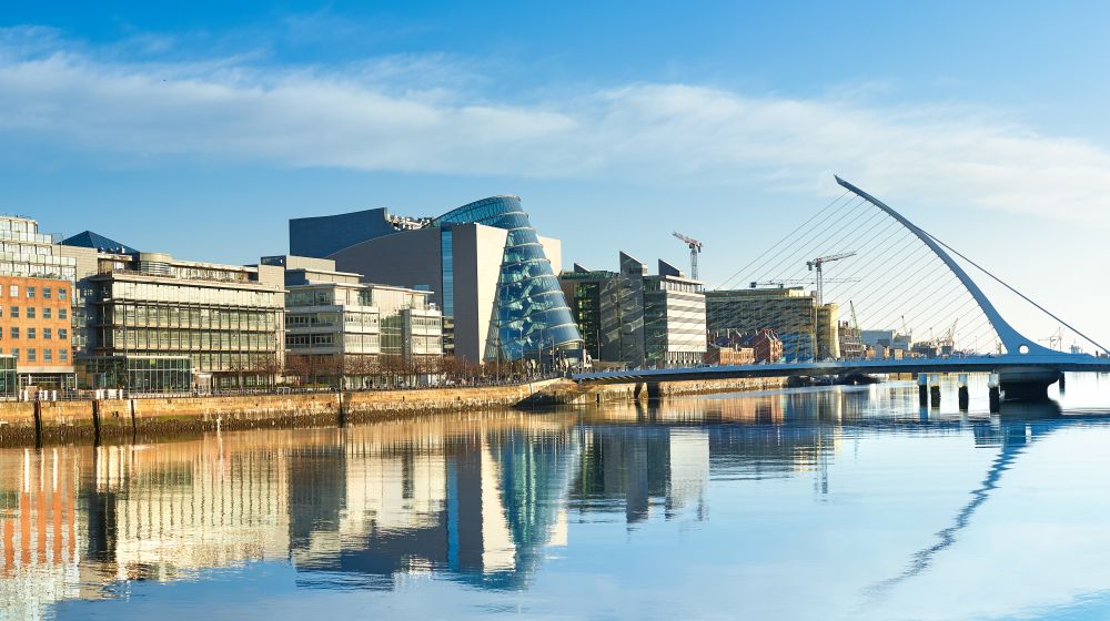 A collection of buildings and a bridge at the Dublin waterfront in Ireland