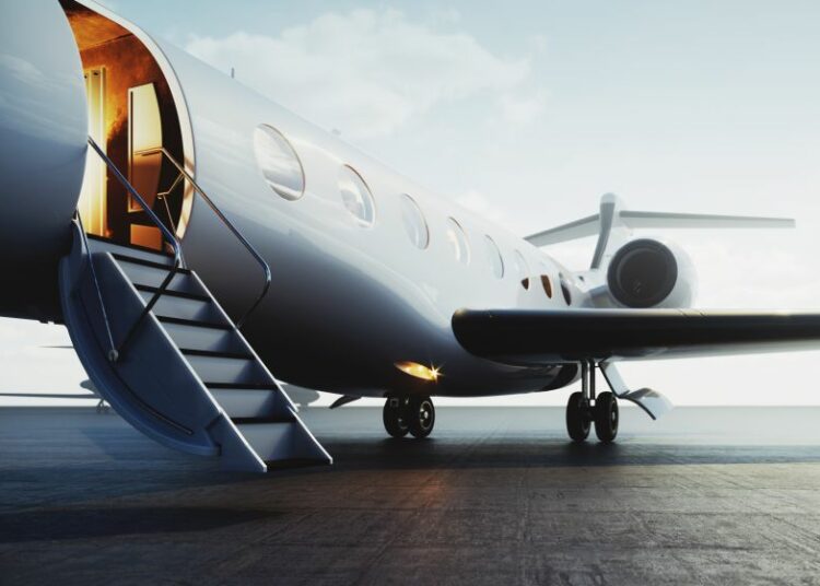 A private jet sitting on the tarmac with a door open