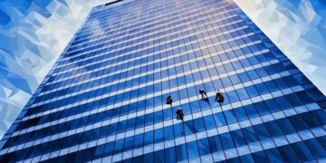Window cleaners cleaning an office block (skyscraper)