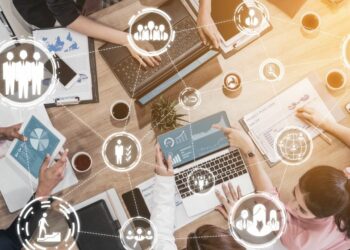 Virtual representation of audience personas connected representing the process of making audience attraction strategy of people sitting at the desk.