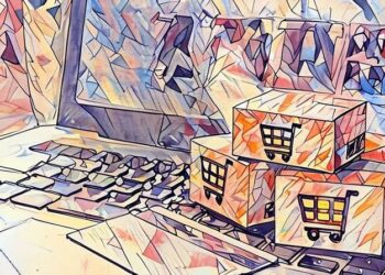 Boxes sitting on a laptop next to a debit card as a symbol of eCommerce shopping