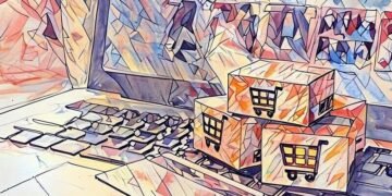 Boxes sitting on a laptop next to a debit card as a symbol of eCommerce shopping
