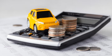 Calculator with toy car ontop