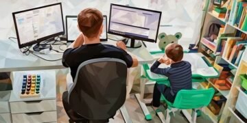 An entrepreneur working from home on a desk with his child playing on a smaller desk next to him