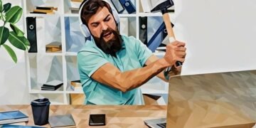 A man about to smash his computer with a hammer as the internet connection has become slow