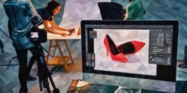 A photo editing suite open on a computer whilst a product photo shoot occurs in the background
