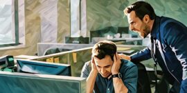 A manager shouting close to an employee with the employee covering their ears in distress